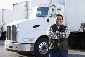 man standing in front of semi truck